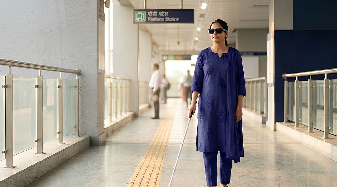 Visually impaired woman navigating a metro station independently using AI assistive technology smart glasses in India