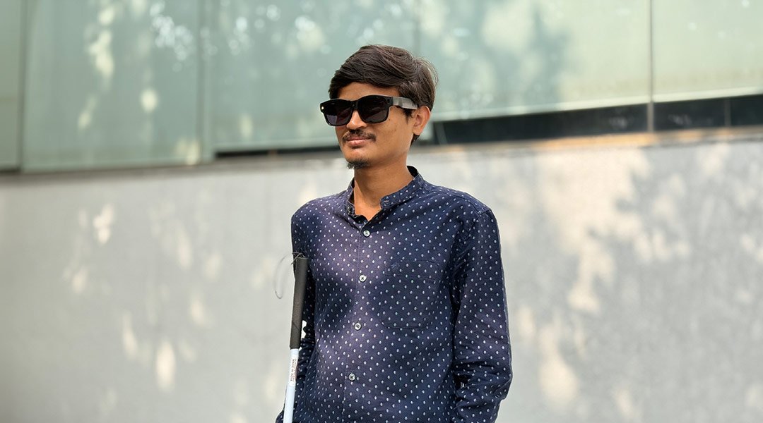 Visually impaired man using smart glasses for outdoor navigation